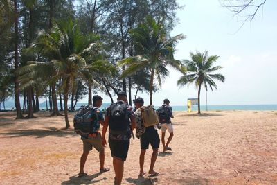 Rear view of people on beach