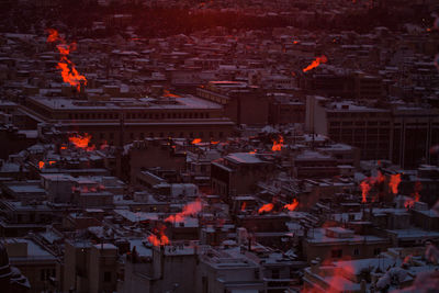 High angle view of fire in city at night