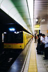 People at railroad station platform