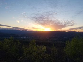 Scenic view of landscape against sky during sunset