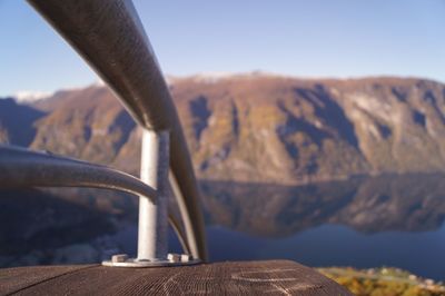 Close-up of railing against mountain