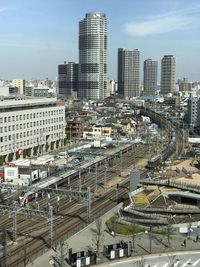 High angle view of buildings in city against sky