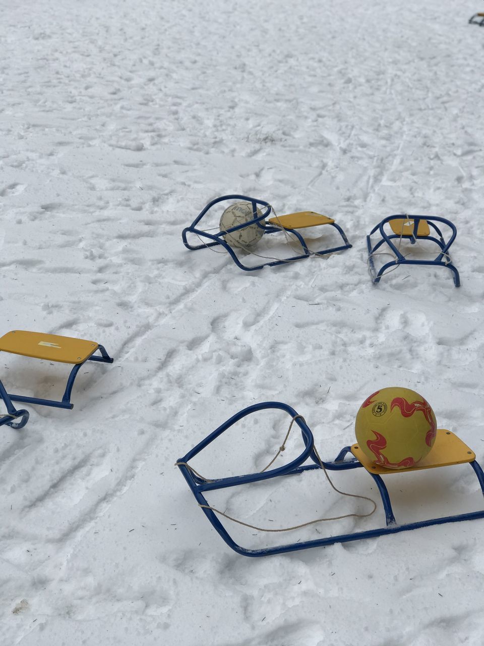 HIGH ANGLE VIEW OF SHOE ON SNOW COVERED LAND