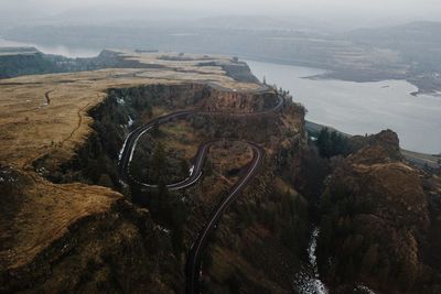 High angle scenic view of plateau and river against sky