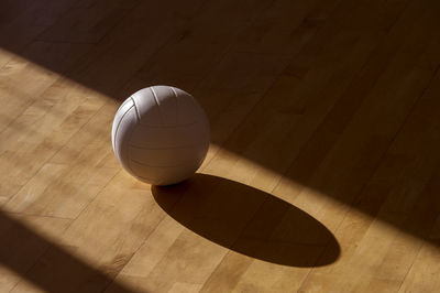 High angle view of ball on hardwood floor