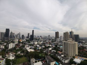 High angle view of modern buildings in city against sky