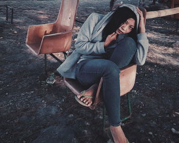 Young woman sitting on bench