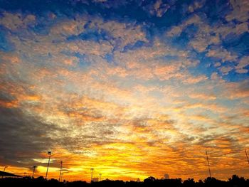 Low angle view of dramatic sky during sunset