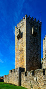 Low angle view of fort against blue sky