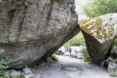 Rear view of men on rock formation