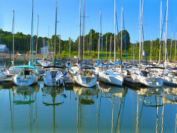 Boats moored in calm lake