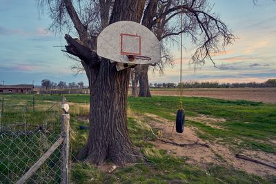 Scenic view of grassy field against cloudy sky