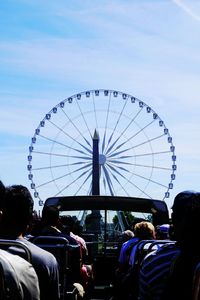 Low angle view of ferris wheel against sky