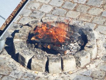 High angle view of fire on wood