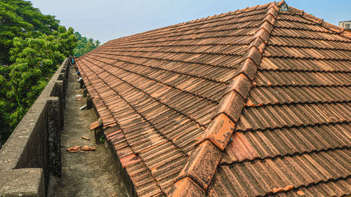 Tilt image of roof and building against sky