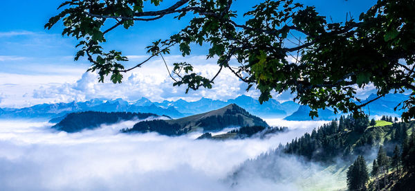 Low angle view of snowcapped mountains against sky