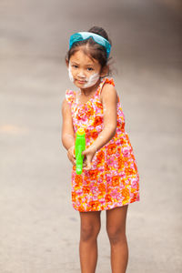 Full length of a girl standing on beach