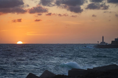 Scenic view of sea against sky during sunset