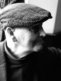 Close-up of senior man wearing flat cap