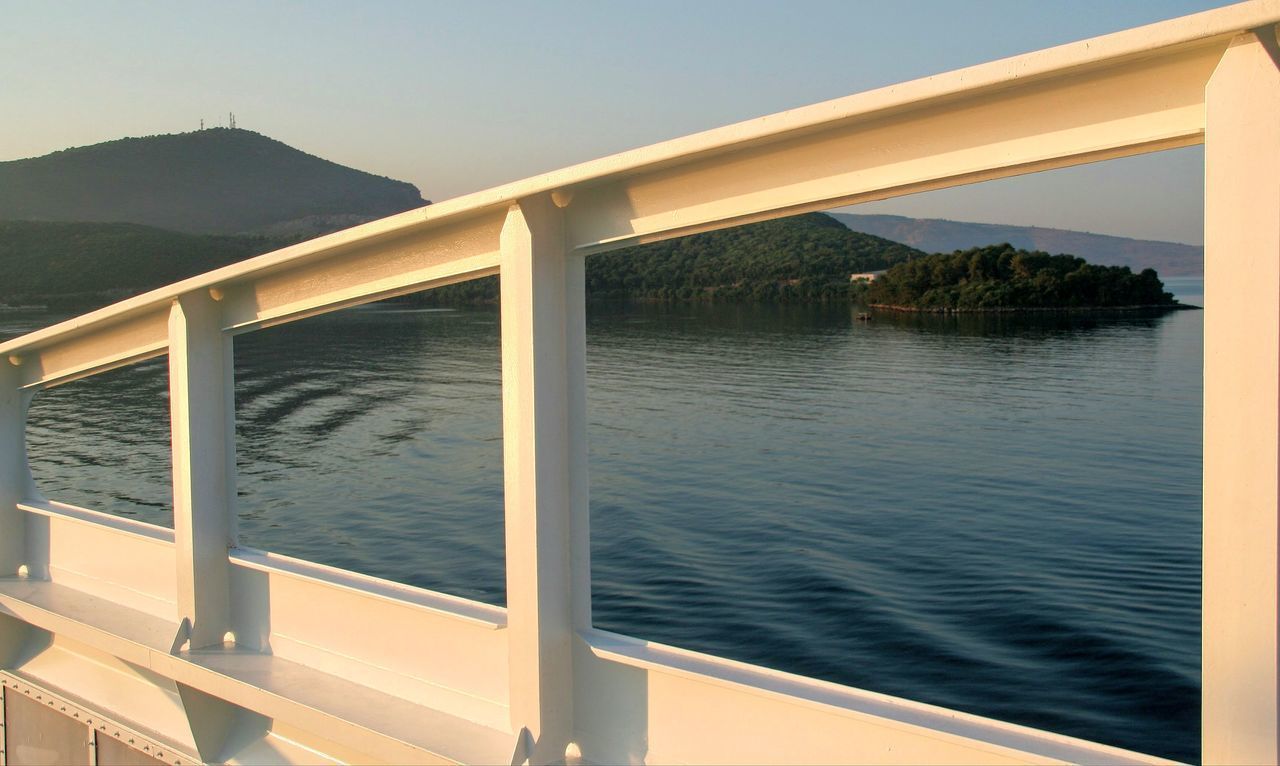 BRIDGE OVER SEA AGAINST CLEAR SKY