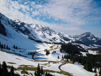 Scenic view of snowcapped mountains against sky