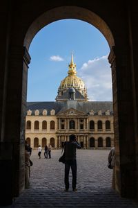 Tourists at entrance of historic building