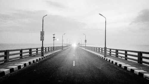 Street by sea against sky