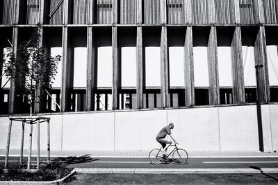 Man cycling on bicycle in city