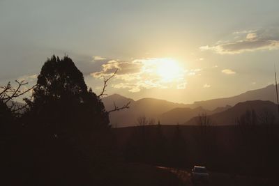 Scenic view of mountains against sky at sunset