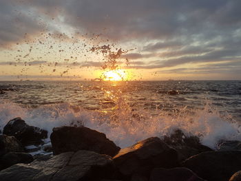 Scenic view of sea against sky during sunset