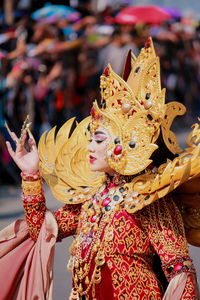 Close-up of woman in fashion show costume