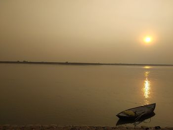 Scenic view of sea against clear sky during sunset