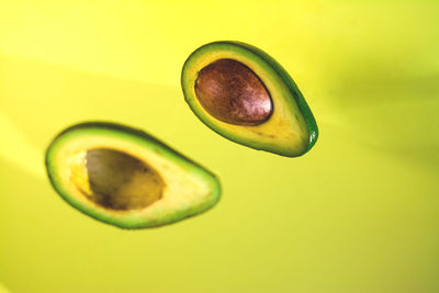 Close-up of lemon slice against yellow background