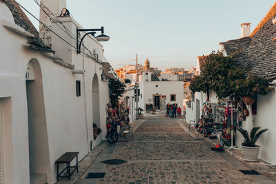 People on street amidst buildings in town