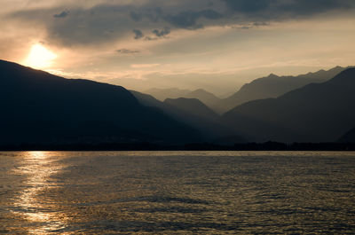 Scenic view of silhouetted mountains against sky during sunset