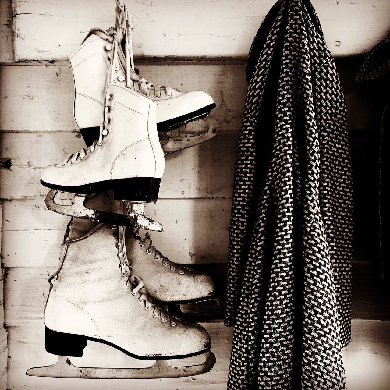 LOW ANGLE VIEW OF SHOES HANGING ON FLOOR