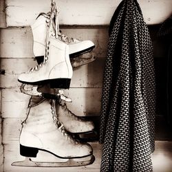 Close-up of shoes hanging on floor