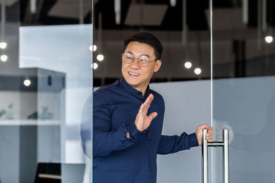 Portrait of businessman standing in office