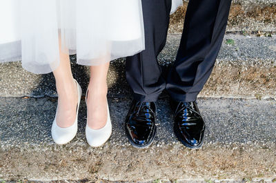 Low section of couple on wedding day