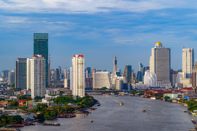 Modern buildings in city against sky