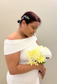 Portrait of young woman with bouquet