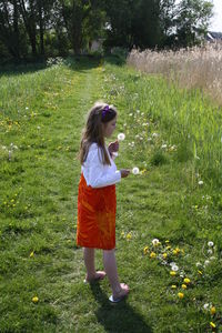 Full length of woman on grassy field