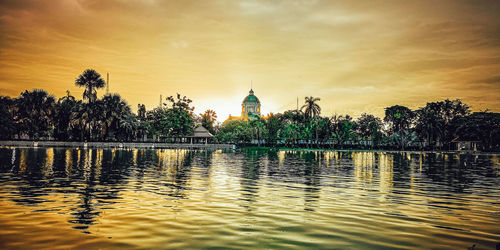 Scenic view of lake against sky during sunset