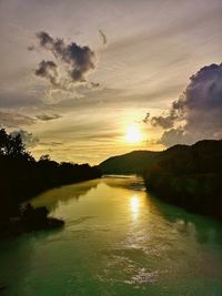 Scenic view of lake against sky during sunset