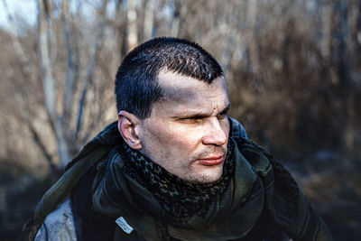 Portrait of young man looking at camera
