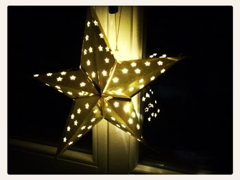 Low angle view of illuminated chandelier