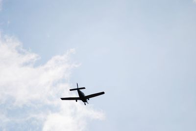 Low angle view of airplane against sky