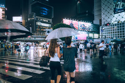 People on wet street during rainy season