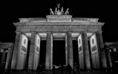 Low angle view of historical building at night