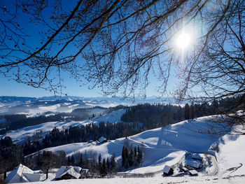 Scenic view of snowcapped mountains against blue sky